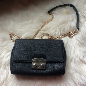 Black cross body bag with gold chain